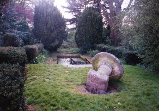 The millstone table and lily pond in April 2002