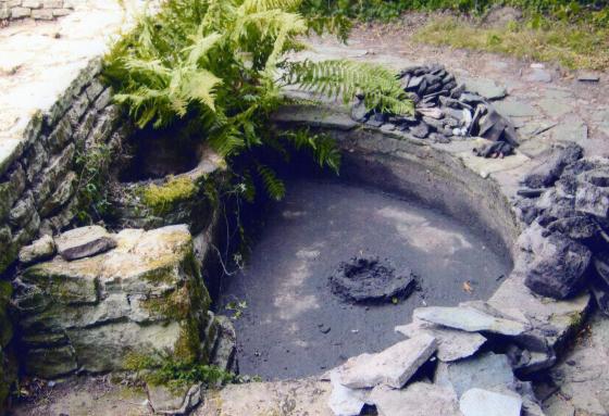 The pond was emptied of black gunge in September 2011. It was also full of pieces of Swithland slate from the surrounding paths.