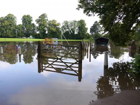 The water floods over into the playing field opposite The Grange, Fowke Street. July 7th 2012