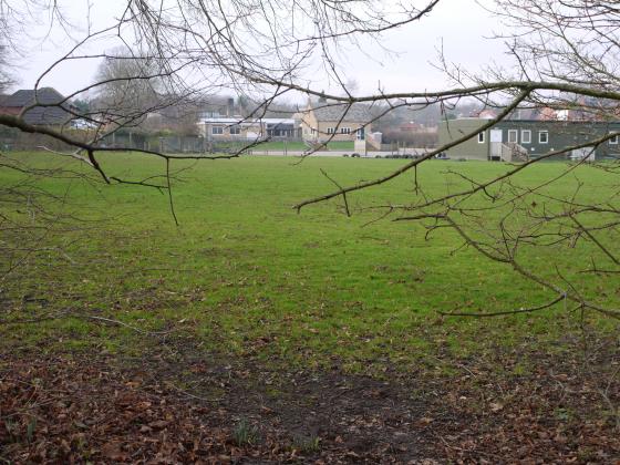 Rear view over school playing field. January 2015